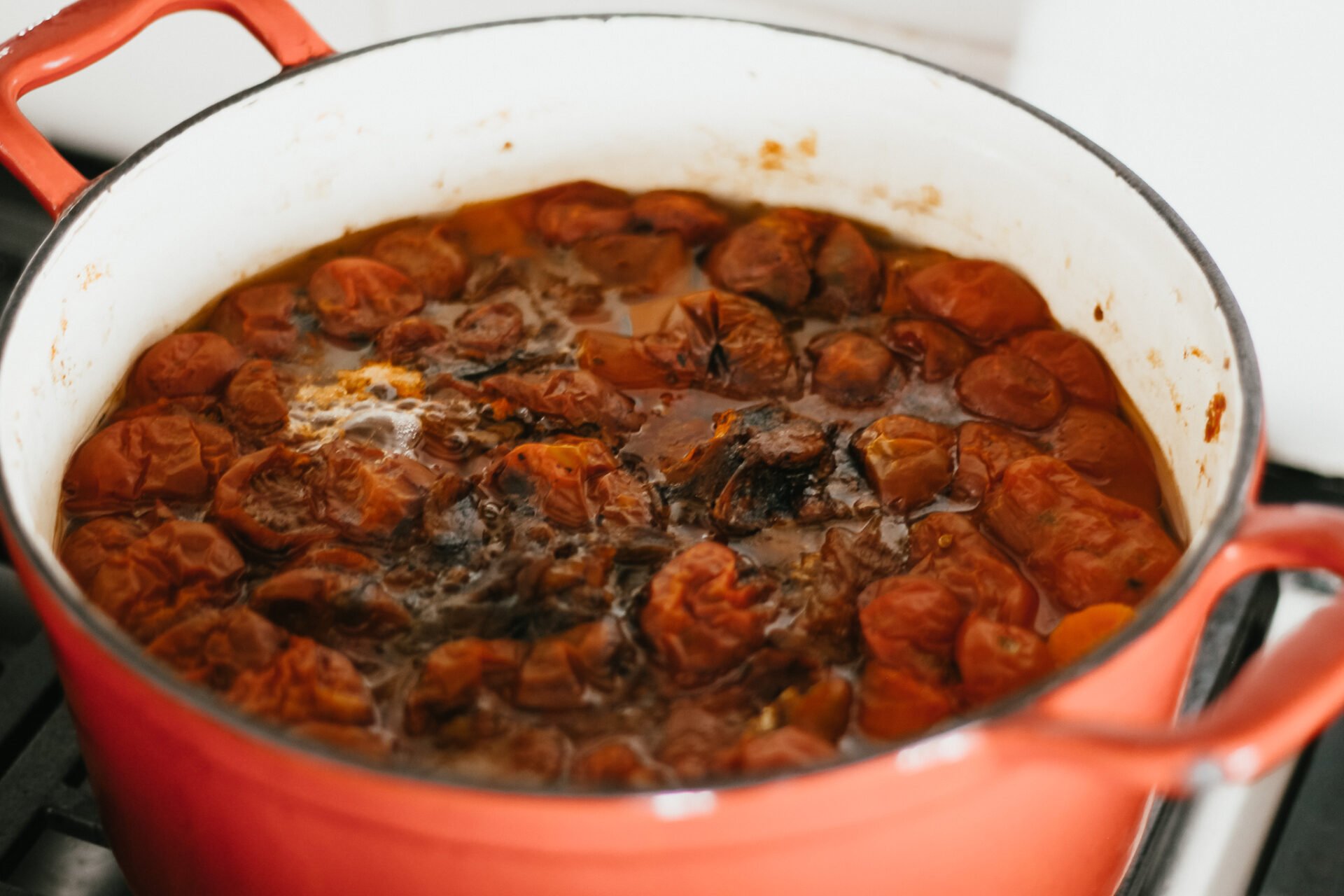 roasting tomatoes and vegetables down on the stove to simmer a marinara sauce for canning
