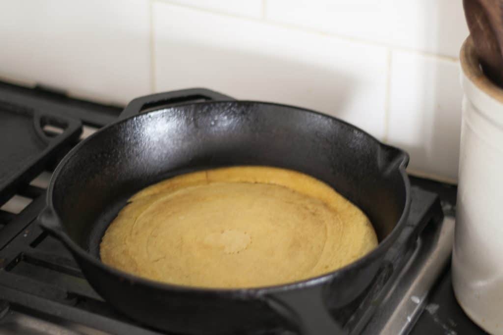 sourdough crepe cooked to golden brown on first side then flipped in skillet.