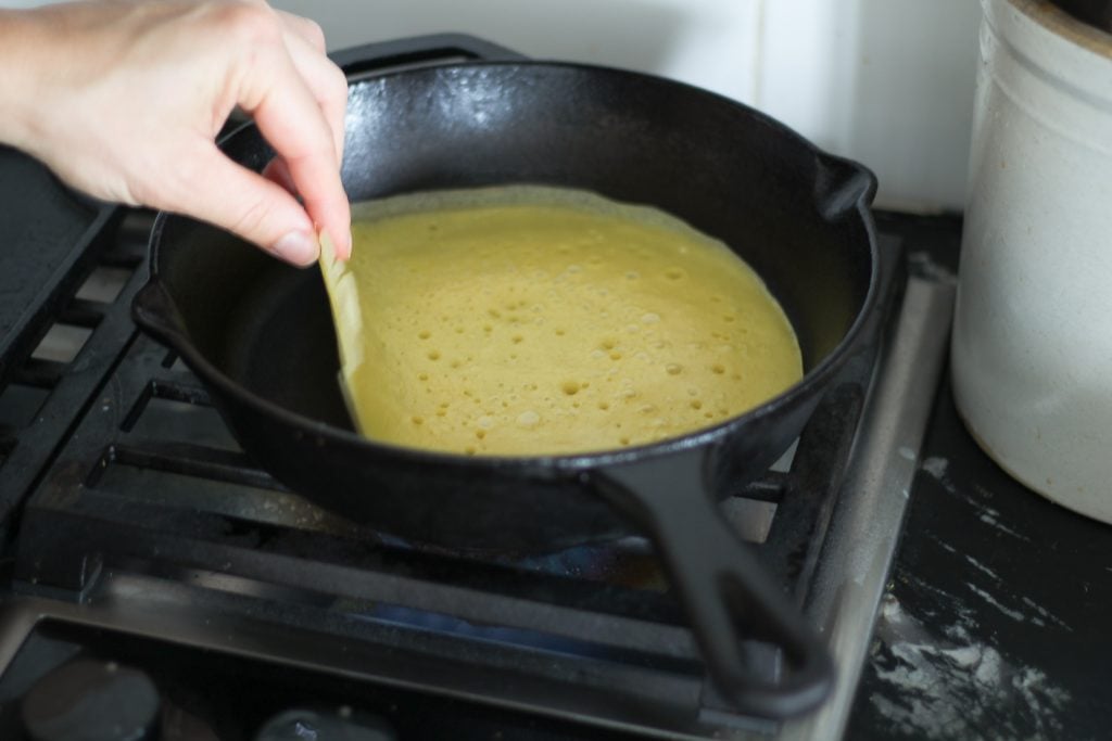 flipping a sourdough crepe