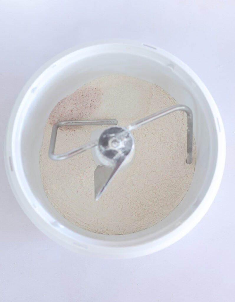 dry ingredients for sourdough cinnamon roll dough in bowl of stand mixer.