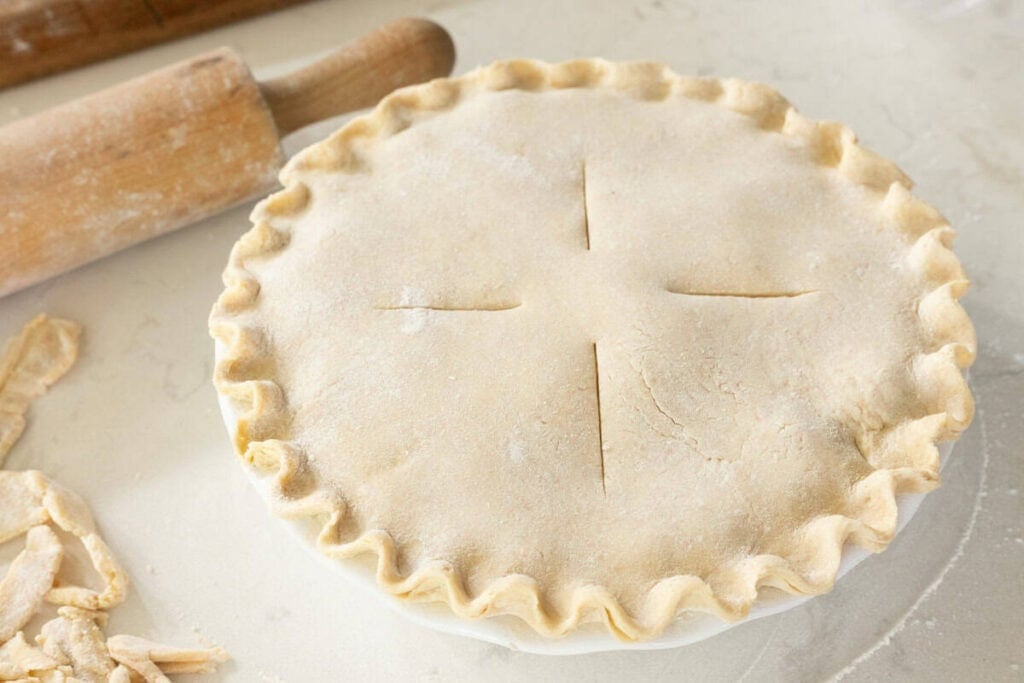 sourdough pie crust crimped and scored in pie plate