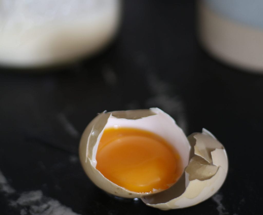 egg yolk in shell for adding to egg yolk coffee.