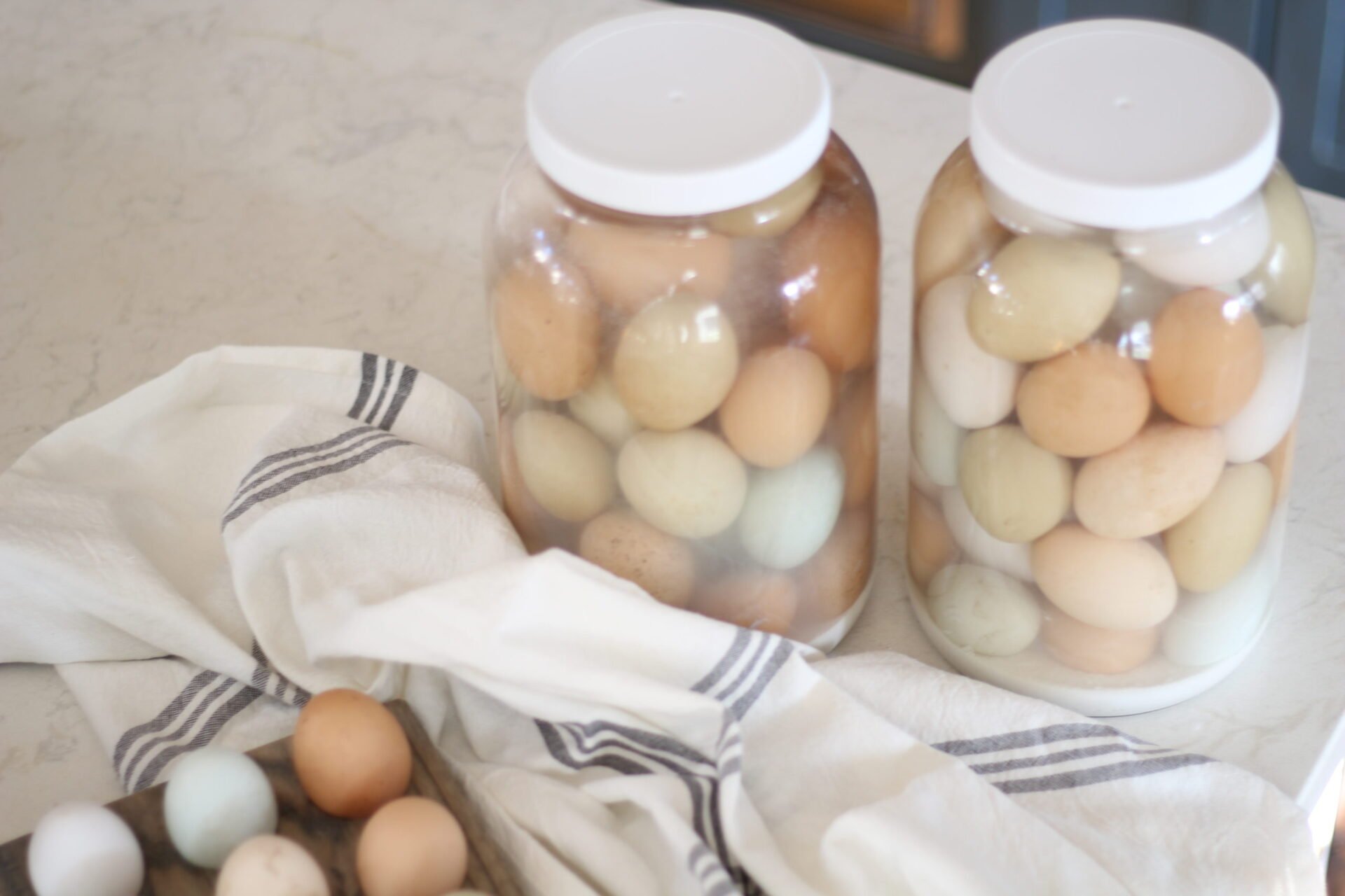 colorful farm fresh eggs in jars