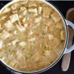 sourdough chicken and dumplings in cast iron pot.