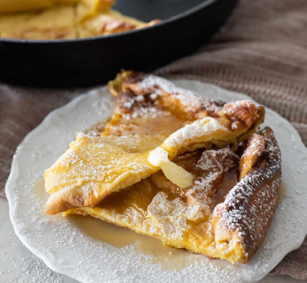 german pancake with butter and maple syrup