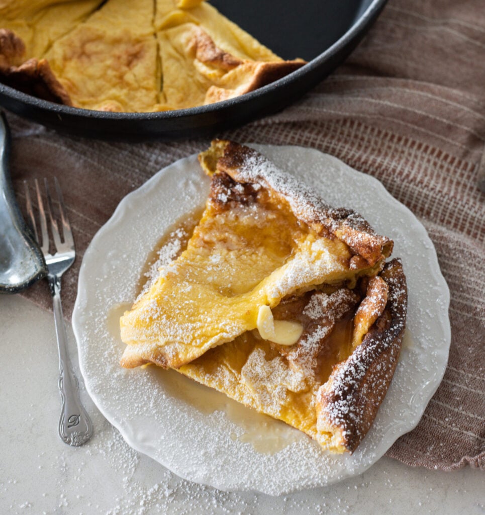 puffy pancake with butter and maple syrup