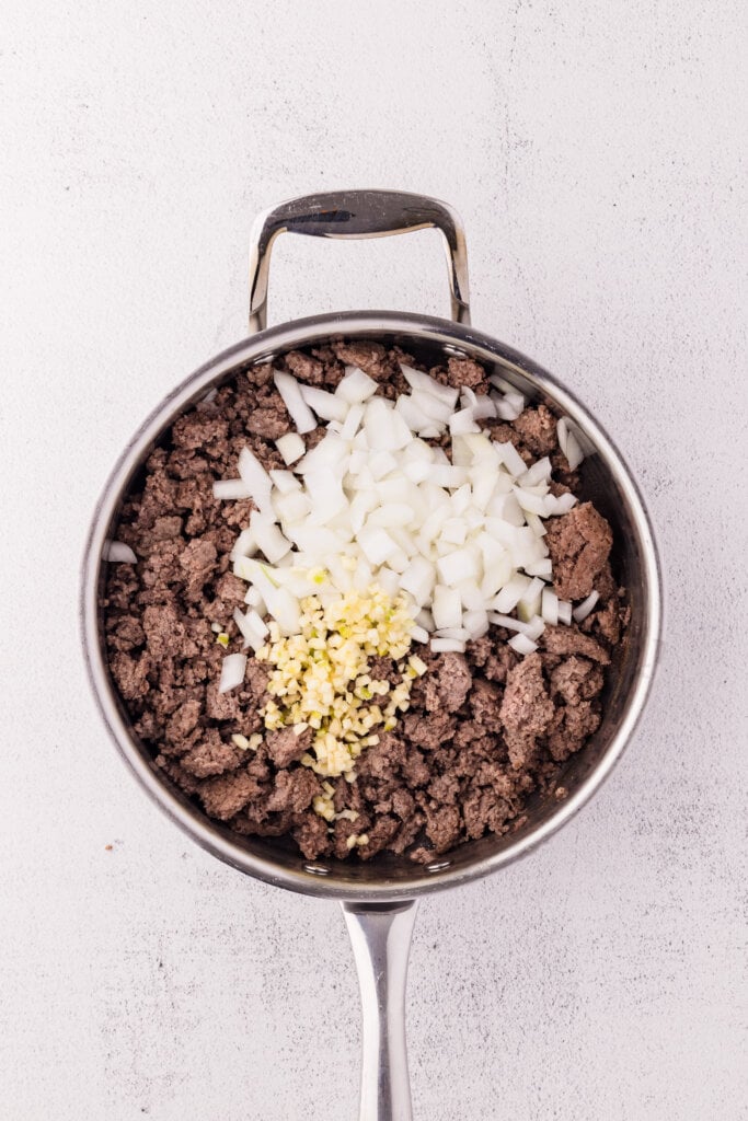 ground beef and sausage with chopped onions and garlic