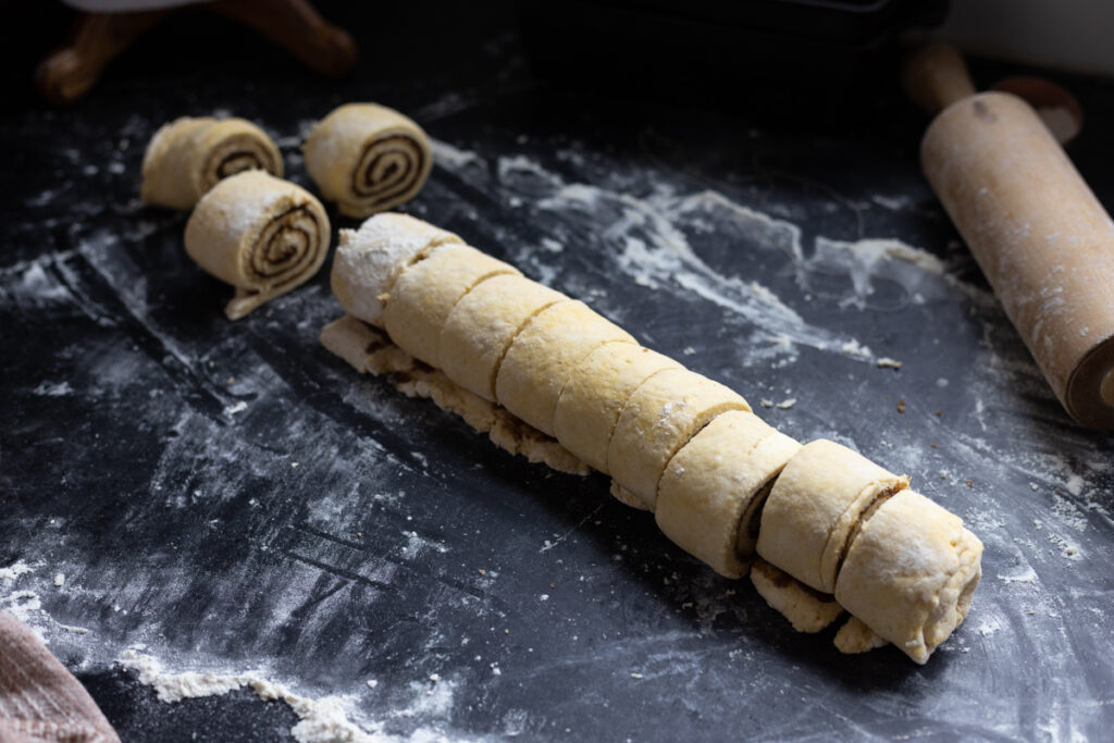 cutting cinnamon roll dough