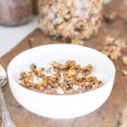 sourdough granola in bowl with milk.