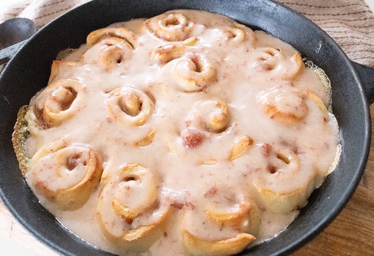 strawberry sourdough cinnamon rolls with strawberry glaze.