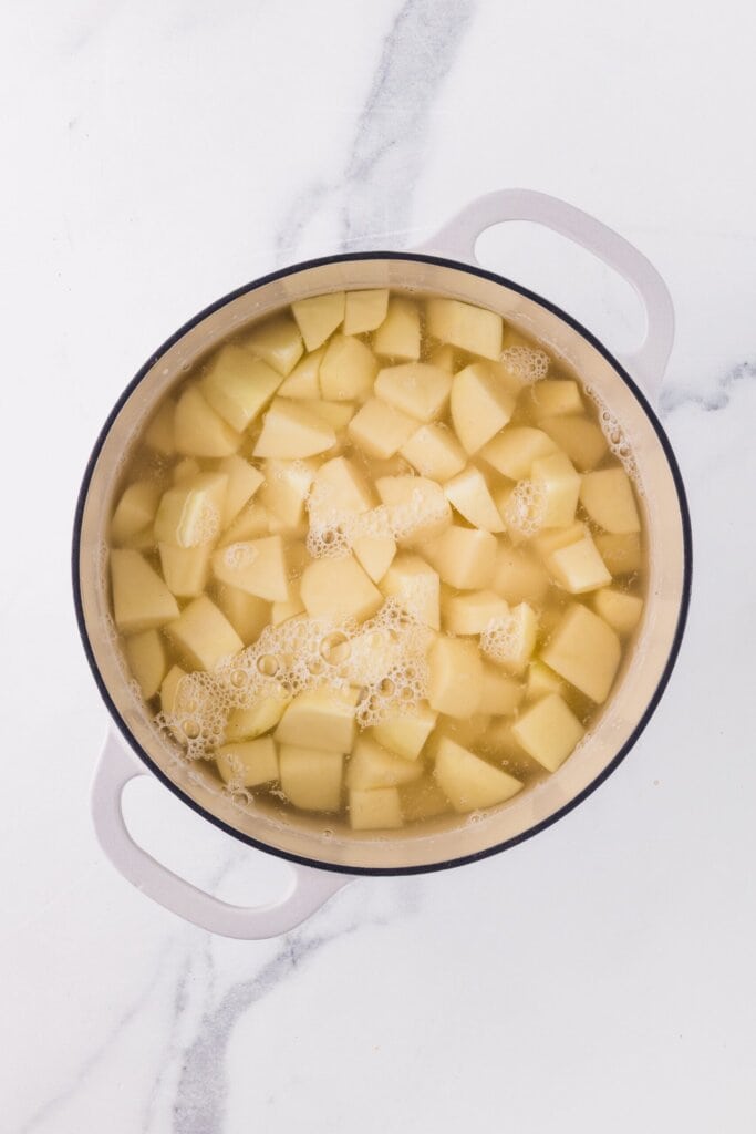 pot of peeled and diced potatoes in boiling water.