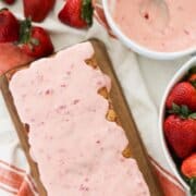 sourdough strawberry bread with fresh strawberry glaze poured over top.
