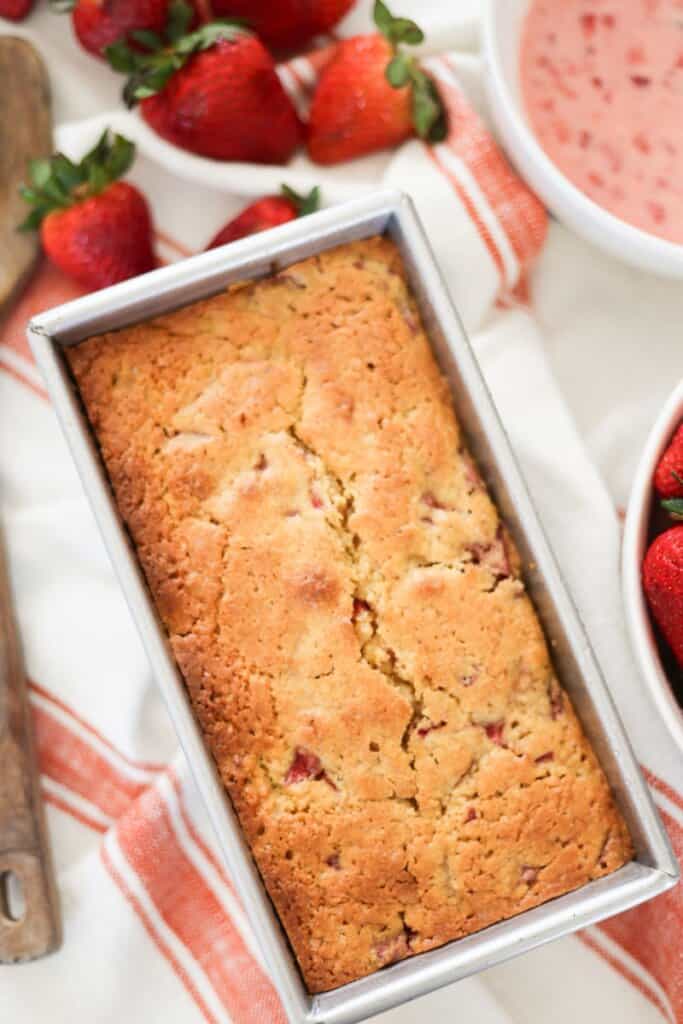 baked sourdough strawberry bread with real strawberries on the side.
