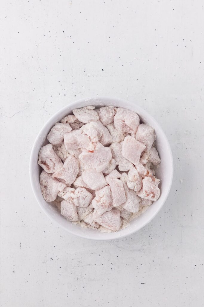 raw chicken breast pieces tossed in breading