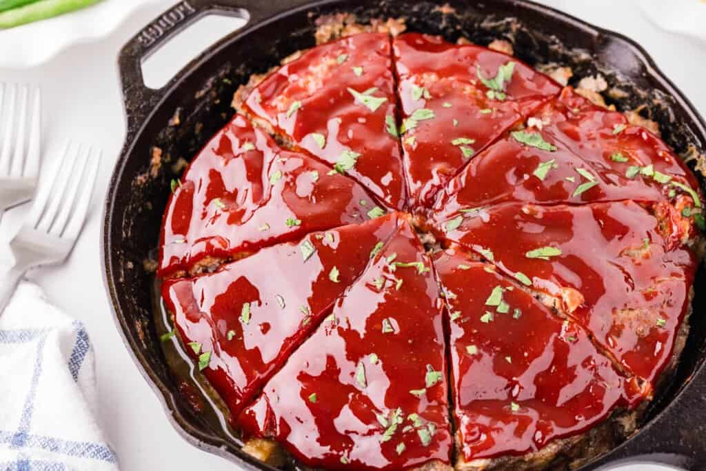 cast iron meatloaf sliced in eight parts