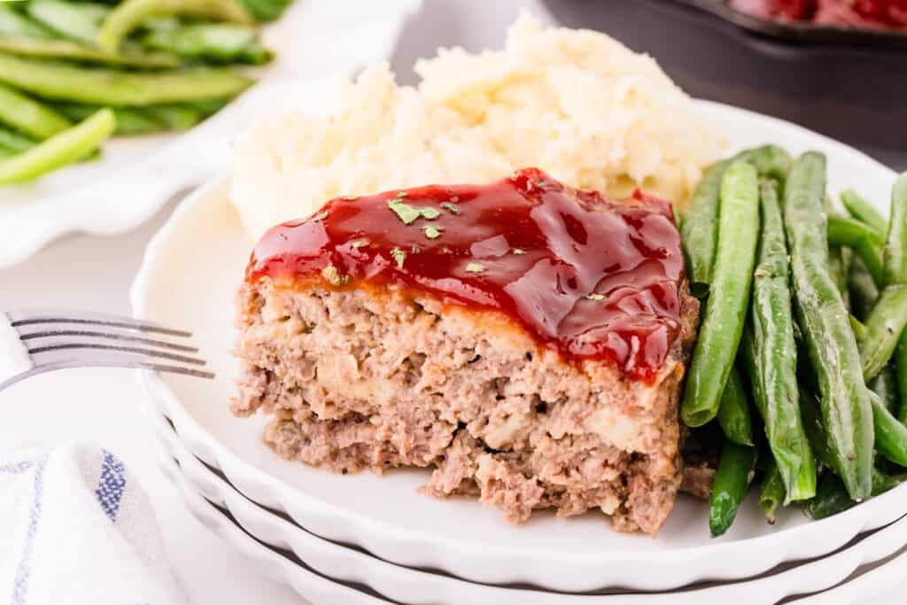 sliced cast iron meatloaf on a plate