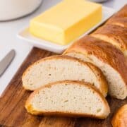 sliced quick french loaf with butter on the side
