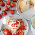 strawberry shortcake with sourdough angel food cake in background.