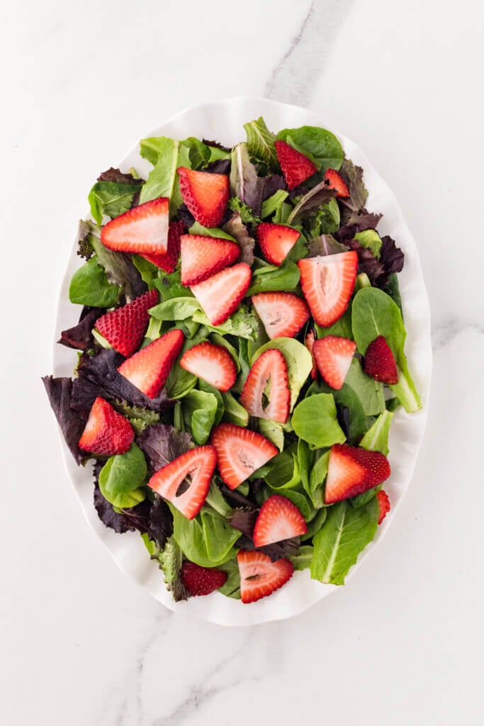 greens with strawberries