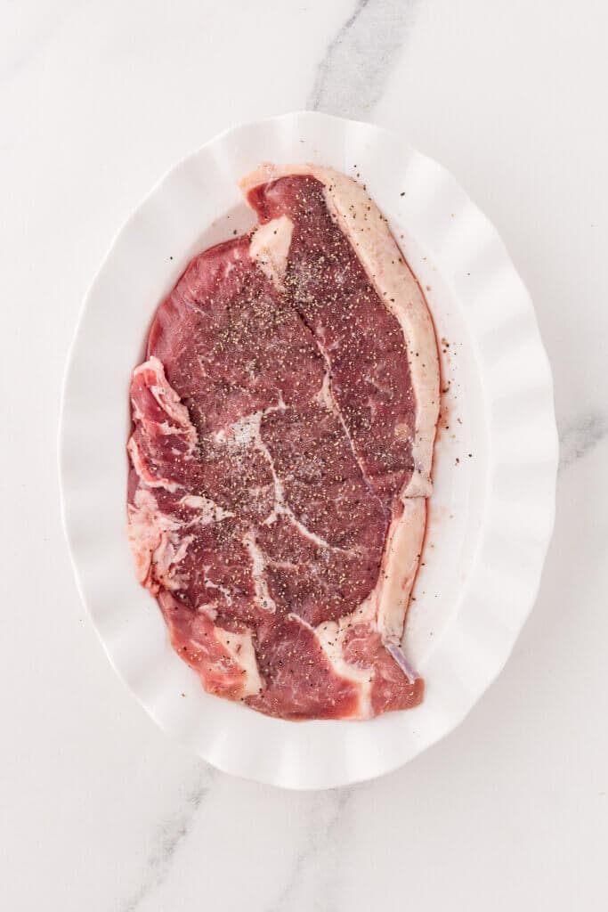 sirloin steak seasoned with pepper and salt