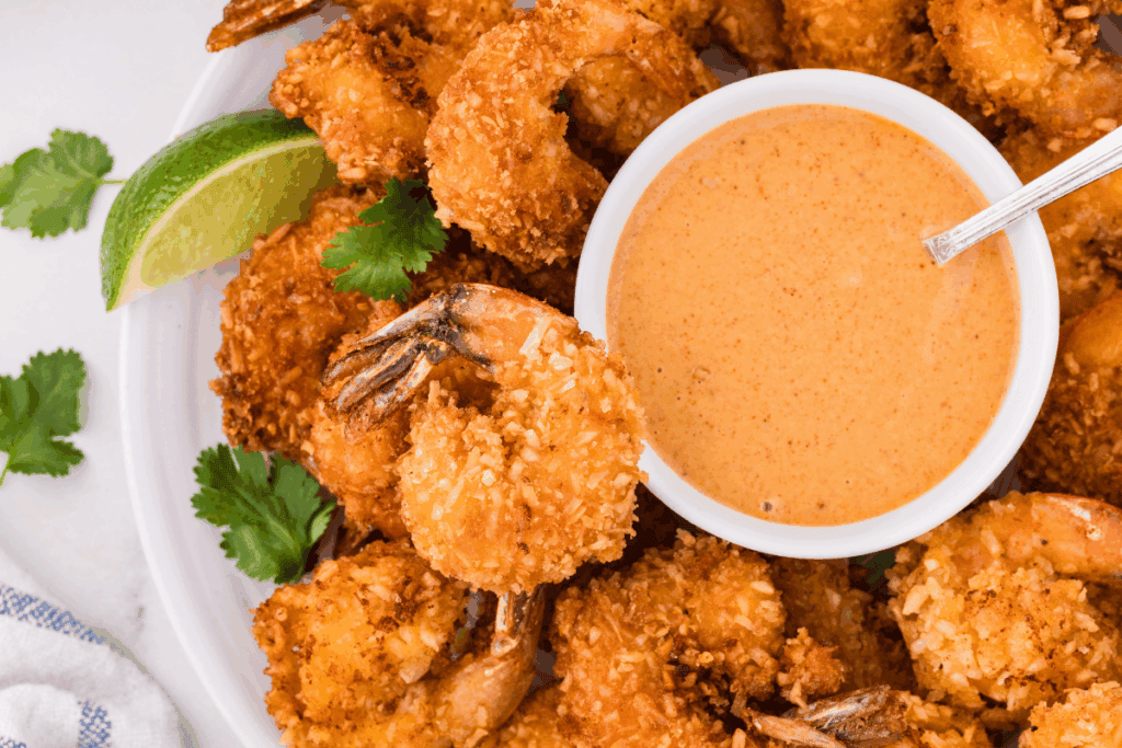 sourdough coconut shrimp with spicy mayo dipping sauce.