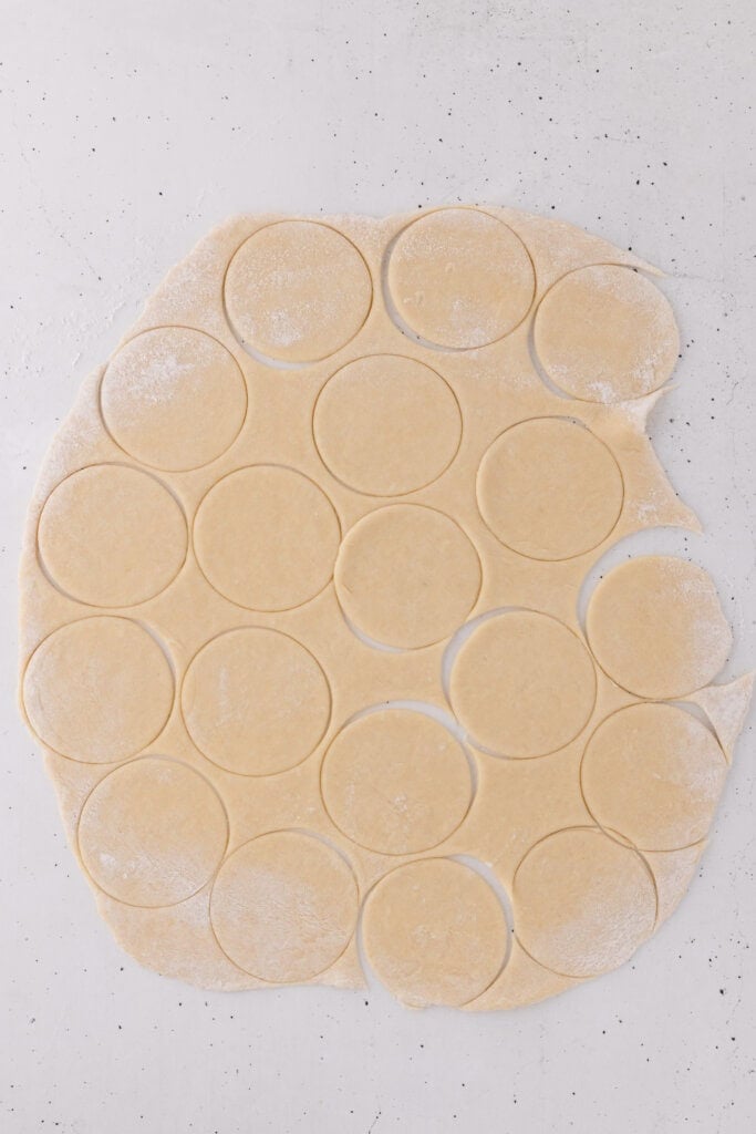 cannoli dough rolled thin and cut into rounds.