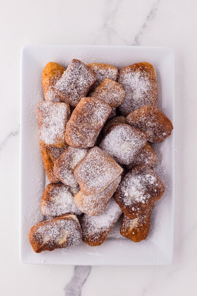 powdered pillowy sourdough beignets
