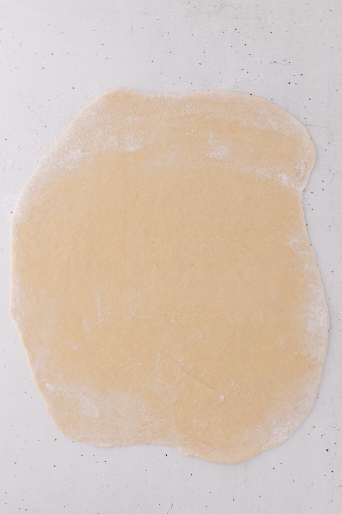 sourdough cannoli dough rolled thin on floured surface.