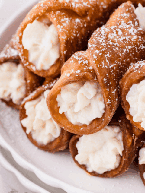 golden fried sourdough cannoli stuffed with sweet ricotta filling