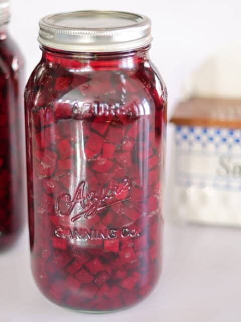 two jars of fermented beets and salt box.