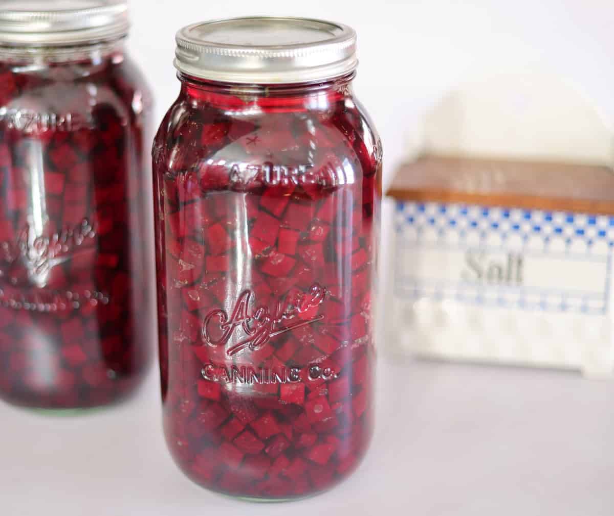two jars of fermented beets and salt box.