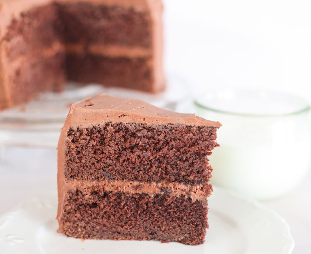 slice of sourdough chocolate cake with chocolate icing.