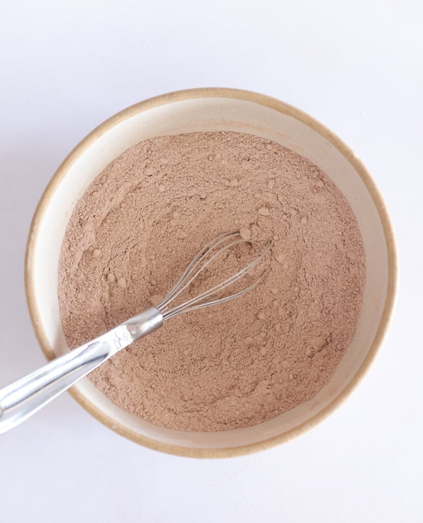 dry ingredients for sourdough chocolate cake mixed in bowl.