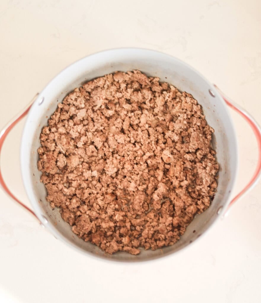 browning ground beef and sausage in bacon grease in dutch oven.