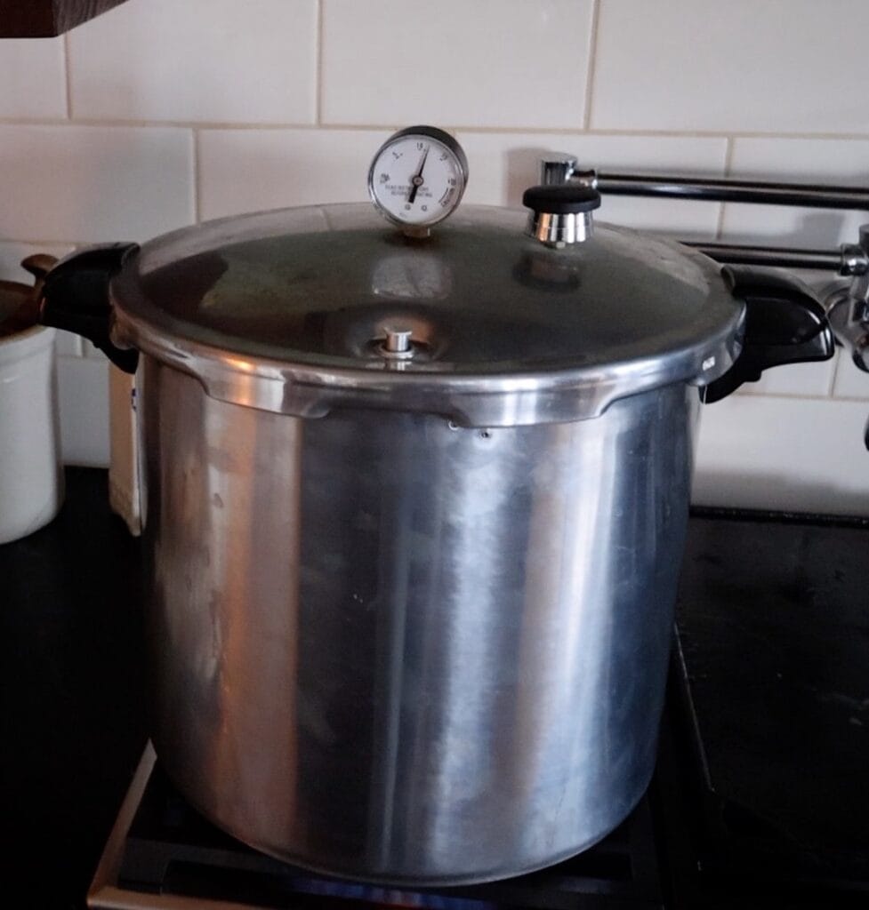 pressure canner with weight added processing bone broth at 11 PSI.
