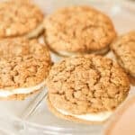 five peanut butter oatmeal cream pies on serving plate.