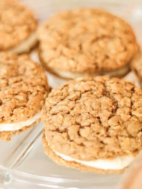 five peanut butter oatmeal cream pies on serving plate.