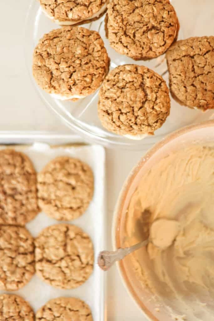 oatmeal cookies with bowl of cream filling for making oatmeal cream pies.